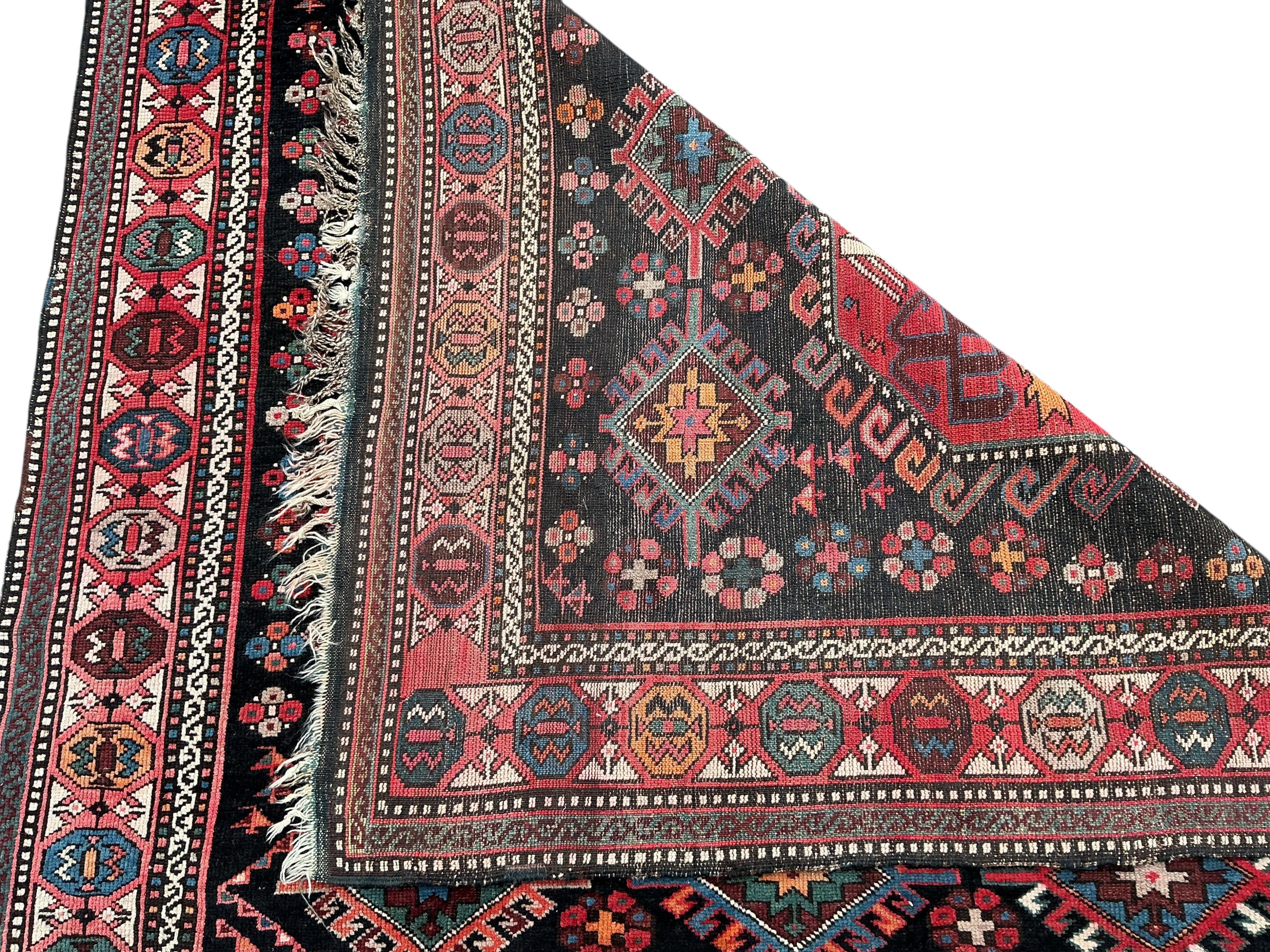 An antique Caucasian blue ground rug, 280 x 140cm